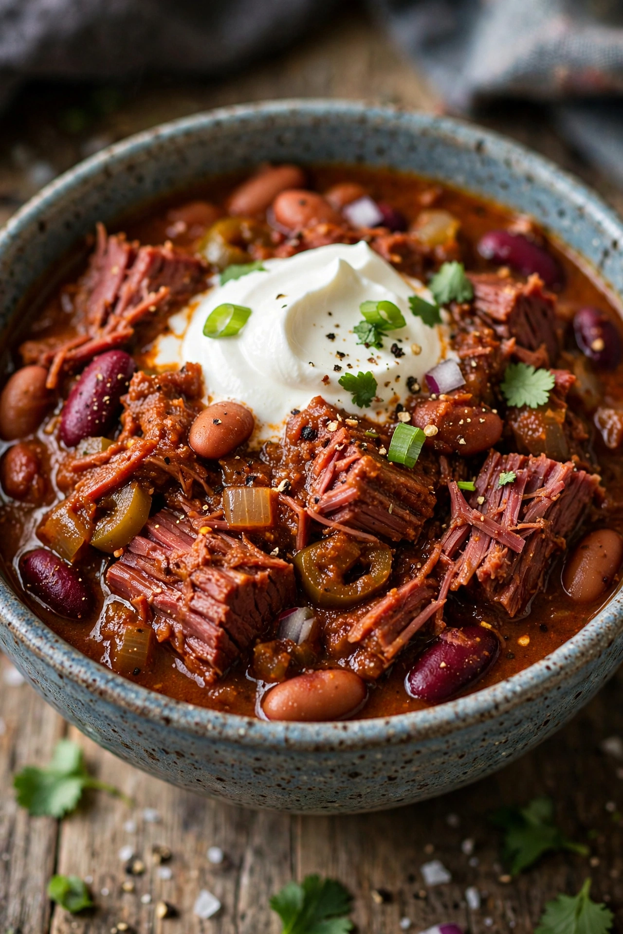 Corned beef chili in a bowl with sour cream